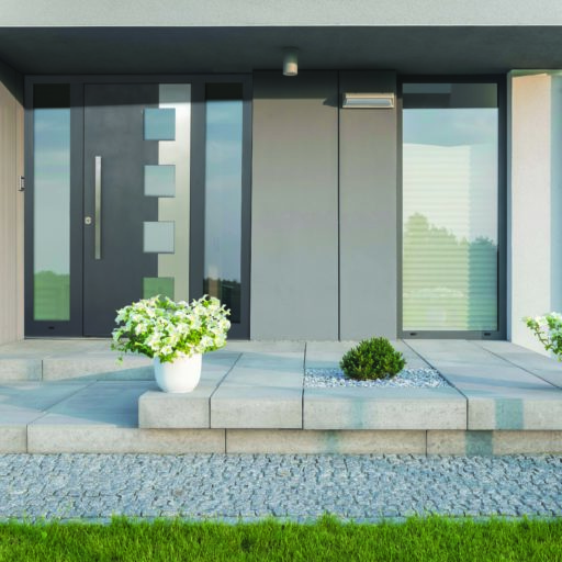 Grey villa with new design entrance, lawn, glass doors and decorative plants